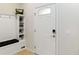 Welcoming entryway with a built-in bench and storage, plus a stylish front door at 1995 Majorca Dr, Kissimmee, FL 34747