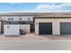 Townhome with two-car garage, covered entrance, and neatly paved driveway at 1995 Majorca Dr, Kissimmee, FL 34747