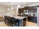Modern kitchen features granite countertops, stainless steel appliances, and a breakfast bar at 1995 Majorca Dr, Kissimmee, FL 34747