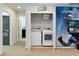 Convenient laundry room with modern washer and dryer units, adjacent to the bathroom at 1995 Majorca Dr, Kissimmee, FL 34747