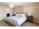 Relaxing main bedroom showcasing a large bed with soft lighting and decorative wall art at 1995 Majorca Dr, Kissimmee, FL 34747