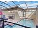 Private backyard pool and spa area with a safety fence and comfortable lounge chairs at 1995 Majorca Dr, Kissimmee, FL 34747
