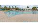 Large resort style pool with lounge chairs and white pergolas at 1995 Majorca Dr, Kissimmee, FL 34747
