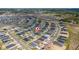 High-angle view of a meticulously designed neighborhood, featuring uniform housing and an evolving suburban landscape at 2059 Dexter St, Haines City, FL 33844