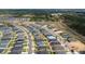 Expansive aerial perspective of a growing residential area, highlighting tidy landscaping and the developing community at 2059 Dexter St, Haines City, FL 33844