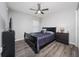 Cozy bedroom with dark wood furniture, natural light, and neutral wall paint at 2059 Dexter St, Haines City, FL 33844