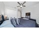 Bedroom showcasing dark furniture, gray bedding, ceiling fan, and double door closet at 2059 Dexter St, Haines City, FL 33844