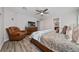 Relaxing bedroom with a leather recliner and a large dresser next to the bed at 2059 Dexter St, Haines City, FL 33844