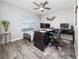 Bright bedroom with a ceiling fan, natural light, and a modern aesthetic at 2059 Dexter St, Haines City, FL 33844