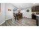 Dining area featuring wood table with seating for four and modern light fixture at 2059 Dexter St, Haines City, FL 33844