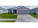 Charming single-story home with well-maintained lawn, landscaping, and a two car garage at 2059 Dexter St, Haines City, FL 33844
