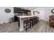 Kitchen showcasing island with bar stool seating, stylish backsplash, and modern lighting at 2059 Dexter St, Haines City, FL 33844