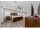 Main bedroom features king bed, wood furnishings, ceiling fan, and en suite bath at 2059 Dexter St, Haines City, FL 33844