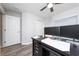 Office with neutral walls, gray flooring, ceiling fan, and double door closet at 2059 Dexter St, Haines City, FL 33844