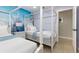 Bedroom featuring canopy beds, Disney themed mural, and ensuite access at 2735 Lido Key Dr, Kissimmee, FL 34747