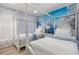 Charming bedroom with twin beds, canopy frames, and a whimsical Disney themed wall mural at 2735 Lido Key Dr, Kissimmee, FL 34747