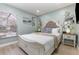 Bright bedroom featuring stylish decor, a comfortable white bed, and complementary bedside tables with lamps at 2735 Lido Key Dr, Kissimmee, FL 34747