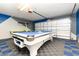 Finished garage with pool table, painted walls, and updated flooring at 2735 Lido Key Dr, Kissimmee, FL 34747