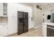 Kitchen boasts plenty of white cabinets, stainless steel refrigerator and lots of counter space at 2735 Lido Key Dr, Kissimmee, FL 34747