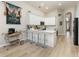 Stylish kitchen with white cabinetry, bar seating, and stainless appliances at 2735 Lido Key Dr, Kissimmee, FL 34747