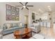 Open floor plan showcasing the living room with a ceiling fan and view of the kitchen at 2735 Lido Key Dr, Kissimmee, FL 34747