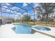 Beautiful screened-in pool and spa combination offers a relaxing outdoor experience at 2735 Lido Key Dr, Kissimmee, FL 34747