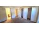 Bedroom with closets, with an open doorway view into the en-suite bathroom at 2781 King Oak Cir, St Cloud, FL 34769