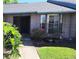 Charming brick home featuring a well-manicured lawn and vibrant landscaping at 2781 King Oak Cir, St Cloud, FL 34769