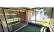 A cozy screened patio perfect for enjoying the outdoors and relaxing at 2781 King Oak Cir, St Cloud, FL 34769