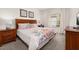 Comfortable bedroom with a floral design bedspread and natural light from window at 2903 Edenshire Way # 103, Kissimmee, FL 34746