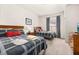 Comfortable bedroom featuring two beds, framed art, soft lighting and a window with curtains at 2903 Edenshire Way # 103, Kissimmee, FL 34746