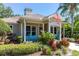 Lucaya Village Clubhouse exterior with inviting patio seating and lush landscaping at 2903 Edenshire Way # 103, Kissimmee, FL 34746