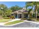 Lucaya Village Clubhouse featuring well-maintained landscaping and an American flag at 2903 Edenshire Way # 103, Kissimmee, FL 34746