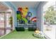 Game room with turf flooring, video game consoles, and Marvel Avengers themed decor at 2903 Edenshire Way # 103, Kissimmee, FL 34746