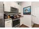 Well-equipped kitchen with stainless steel appliances and granite countertops at 2903 Edenshire Way # 103, Kissimmee, FL 34746