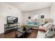Living room with comfortable seating, bright decor, and TV at 2903 Edenshire Way # 103, Kissimmee, FL 34746