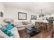 Open-concept living room flowing into dining area, perfect for entertaining at 2903 Edenshire Way # 103, Kissimmee, FL 34746