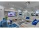 Clubhouse lounge area with plush couches, a TV, and stylish decor at 2903 Edenshire Way # 103, Kissimmee, FL 34746