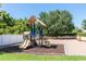 Outdoor playground with slides, climbing structure, and tire steps at 2903 Edenshire Way # 103, Kissimmee, FL 34746