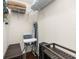 Functional storage room with shelving, a high chair and an ironing board at 2903 Edenshire Way # 103, Kissimmee, FL 34746