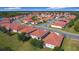 An aerial view of the neighborhood showcasing the tidy homes and manicured lawns at 3105 Sangria St, Kissimmee, FL 34744