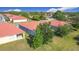 Aerial view of the neighborhood with well-maintained lawns and Spanish tile roofs at 3105 Sangria St, Kissimmee, FL 34744