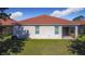 Exterior shot of the house highlighting the backyard and covered patio area at 3105 Sangria St, Kissimmee, FL 34744