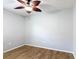 This bedroom features wood-look tile flooring and a ceiling fan with wood-look blades at 3105 Sangria St, Kissimmee, FL 34744