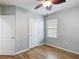 This bedroom features wood-look tile flooring and a window at 3105 Sangria St, Kissimmee, FL 34744