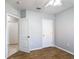 This bedroom features wood-look tile flooring and an open closet door at 3105 Sangria St, Kissimmee, FL 34744