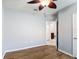 This bedroom features wood-look tile flooring and a ceiling fan with wood-look blades at 3105 Sangria St, Kissimmee, FL 34744