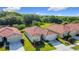Beautiful community offering homes with tile roofs, attached garages, and manicured lawns at 3105 Sangria St, Kissimmee, FL 34744