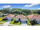 Well-maintained homes with tile roofs, attached garages, and lush green lawns in a desirable community at 3105 Sangria St, Kissimmee, FL 34744