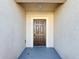 Welcoming entryway with a traditional dark wood door, textured walls, and overhead lighting at 3105 Sangria St, Kissimmee, FL 34744